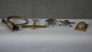 A collection of brass items. Including a brass frog, aeroplane, scarab and crab box. L.30 W.23cm