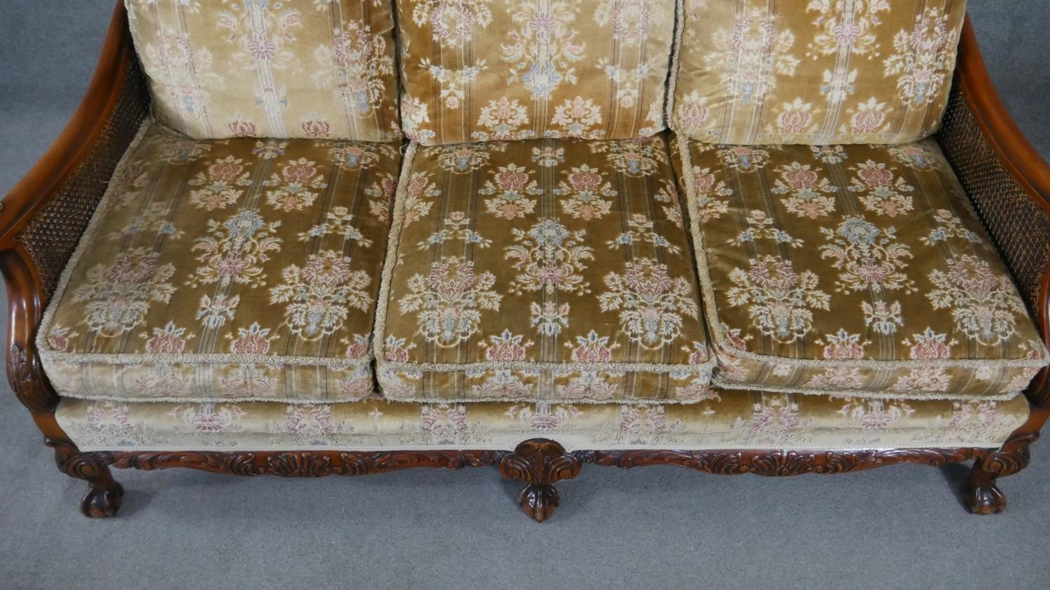 A mid century carved walnut three seater bergere sofa with double caned sides in cut floral - Image 5 of 7