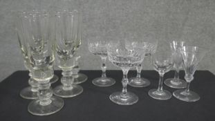 A collection of eleven glasses. Including a set of five ball stem design wine glasses, a set of