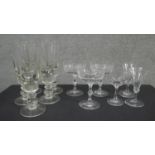 A collection of eleven glasses. Including a set of five ball stem design wine glasses, a set of