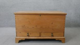 A 19th century pine mule chest fitted with base drawers on bracket feet. H.67 W.110 D.55 cm