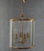 A Victorian style brass and glass circular four branch lantern. Diam.32cm