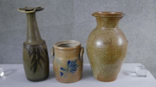 Three pieces of art pottery. Including a twin handled stoneware jar with incised rooster design, a