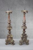 A large pair of 19th century carved giltwood Rococo style candle sticks with foliate design. H.70