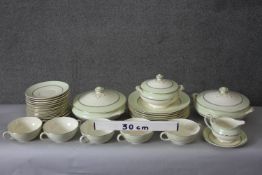 A Furnival's pale green and gilt design ceramic part dinner set. Comprising of eight dinner