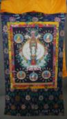 An early C20th Tibetan Thanka of thousand-armed Avalokitesvara. Full silk brocade surround and