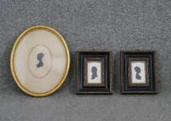 Three framed and glazed 19th century silhouette profile pictures of females. H.29 W.24cm (largest)
