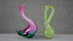Two Art Glass figures. One of a water bird in purple and turquoise glass and an abstract pale