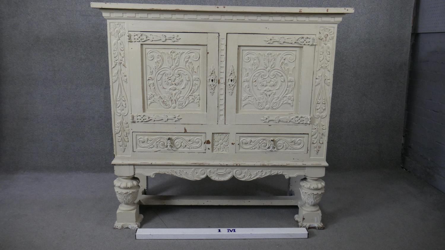 An early 20th century distressed painted 18th century style cabinet with all over carving on - Image 2 of 7