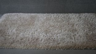 A contemporary Camel ground shag pile carpet. 230x160