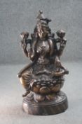 An early 20th century copper figure of Lakshmi sitting on a lotus flower base. H.66 W.30 D.16cm.