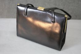 A vintage Bourne & Hollingsworth leather handbag in it's original box. H.48 W.28 D.10 cm
