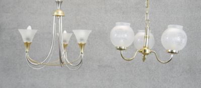 Two three branch chandeliers. One with frosted conical shades and bi-colour metal frame, the other