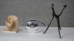 An Art Deco alabaster table lamp along with a chrome eye and African hardwood giraffe bowl stand.