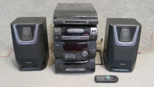 A vintage Sony and Panasonic Hi-fi system with remote and speakers. H.40 W.28cm