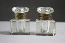 A pair of 19th century cut glass and brass lidded ink wells. H.6 W.2 D.2cm.