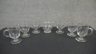 A set of six 19th century handled posset glasses with petal facet decoration along with a blown