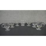 A set of six 19th century handled posset glasses with petal facet decoration along with a blown