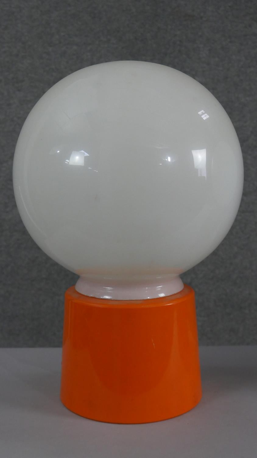 Two mid century green and orange acrylic table lamps with opaque glass white globe shades. H.34 W. - Image 3 of 5