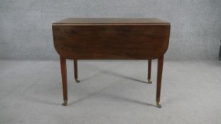 A 19th century mahogany drop flap Pembroke table fitted with frieze drawer on square tapering