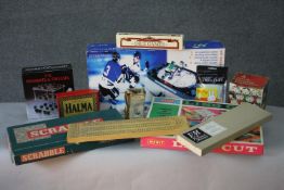 A collection of eleven vintage boxed game and toys. Including Scrabble, a lino cutting set, Halma,