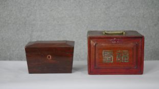 An early 19th century rosewood sarcophagus form tea caddy with fitted interior and a carved and