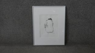 A framed and glazed signed print of a seated figure. Signed Deschamps, label verso. H.51 W.41 cm