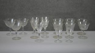 A collection of sixteen Victorian etched drinking glasses. Including a set of six vine design