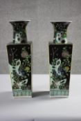A pair of early 20th century Famille Noir square four seasons hand painted porcelain vases. Kangxi