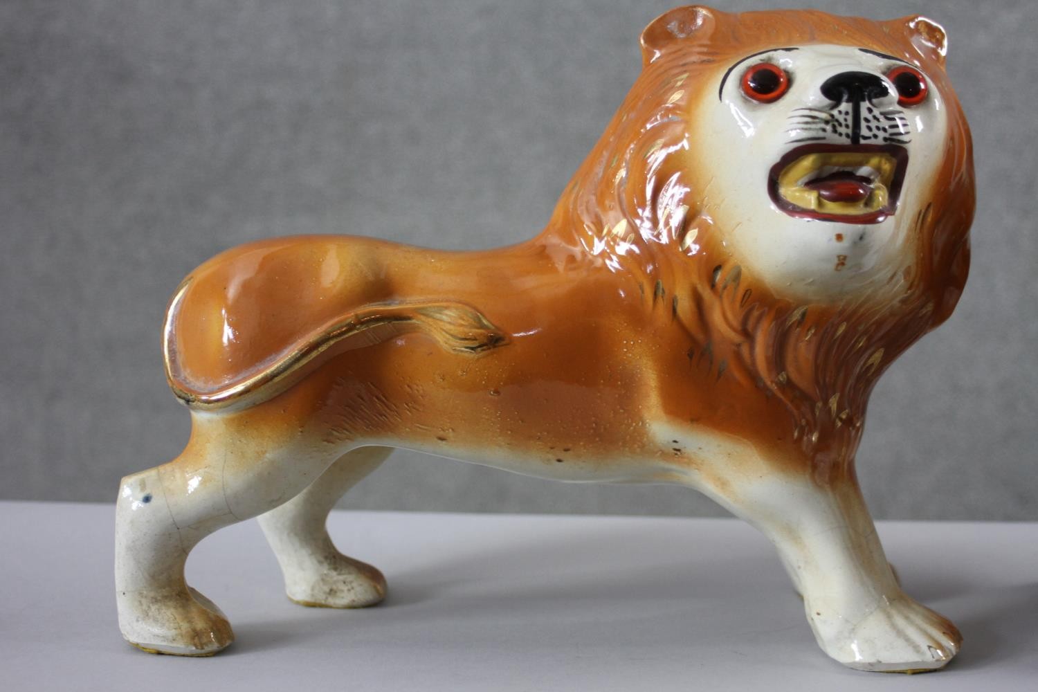 A pair of 19th century Staffordshire pottery lions with glass eyes along with a pair of - Image 7 of 8