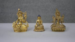 Three gilt metal Tibetan figures. Two 19th century gilded and hand painted; one of Buddha and one of