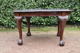 A C.1900 mahogany Georgian style dining table with wind out mechanism on carved cabriole ball and