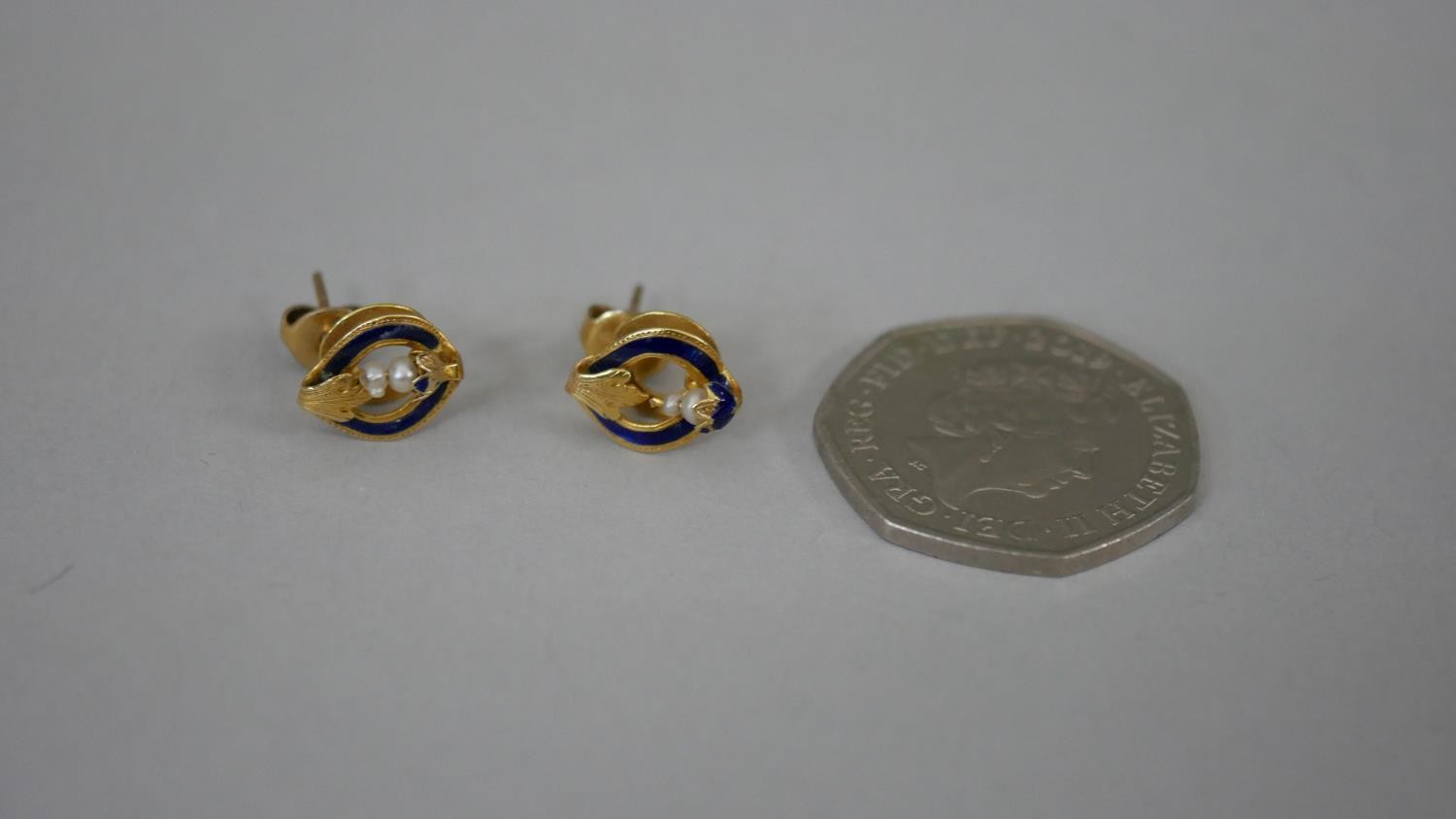 A pair of French 19th century seed pearl and blue enamel 18 carat yellow gold stud earrings. - Image 2 of 6