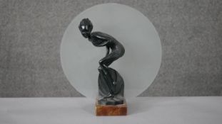 An Art Deco spelter bather figural lamp on marble base with frosted disc shade. Diam.30 D.12cm