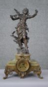 After Louis Moreau- A spelter and alabaster mantle clock with sculpted winged nymph to the top (wing