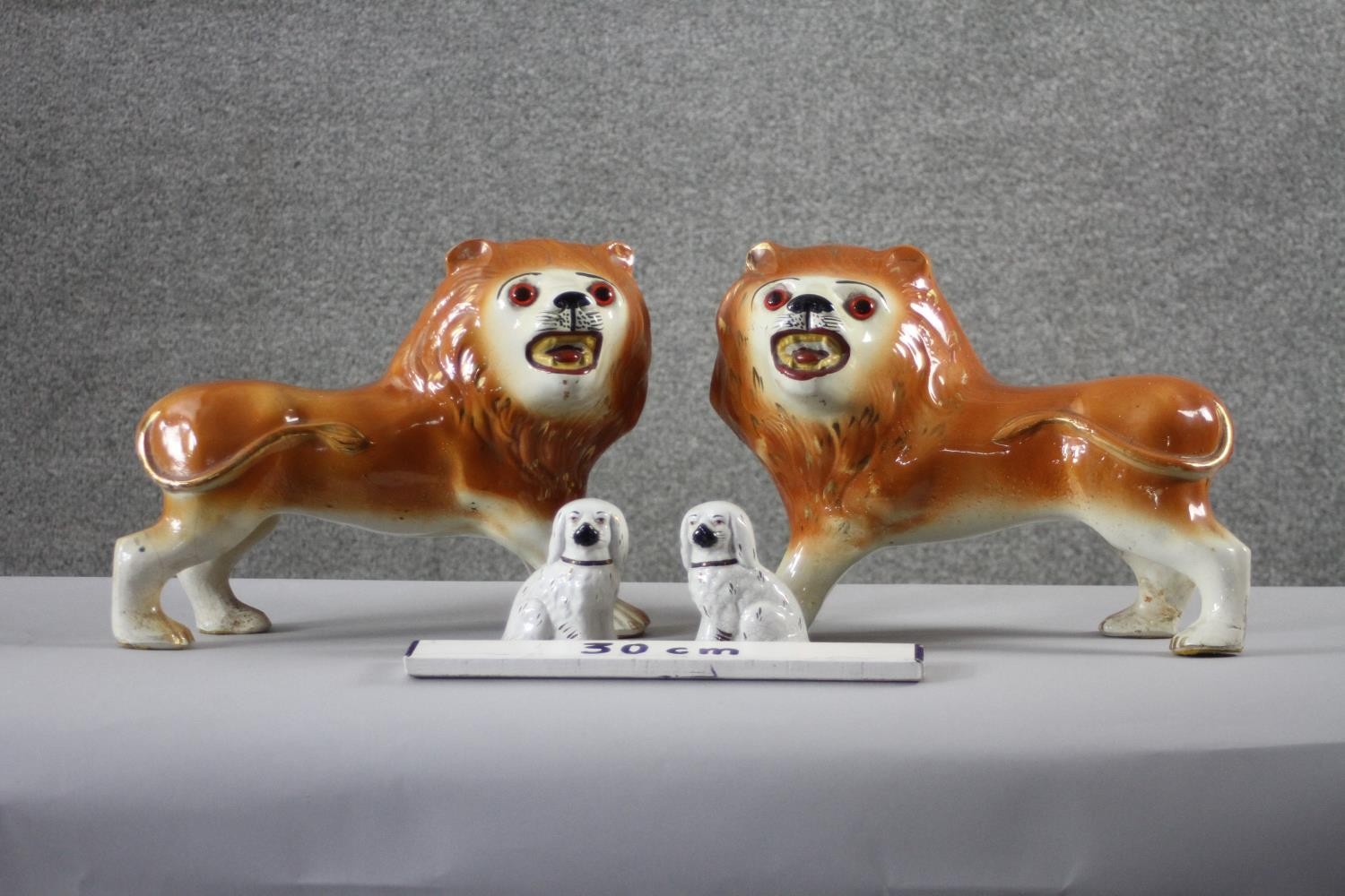 A pair of 19th century Staffordshire pottery lions with glass eyes along with a pair of - Image 3 of 8