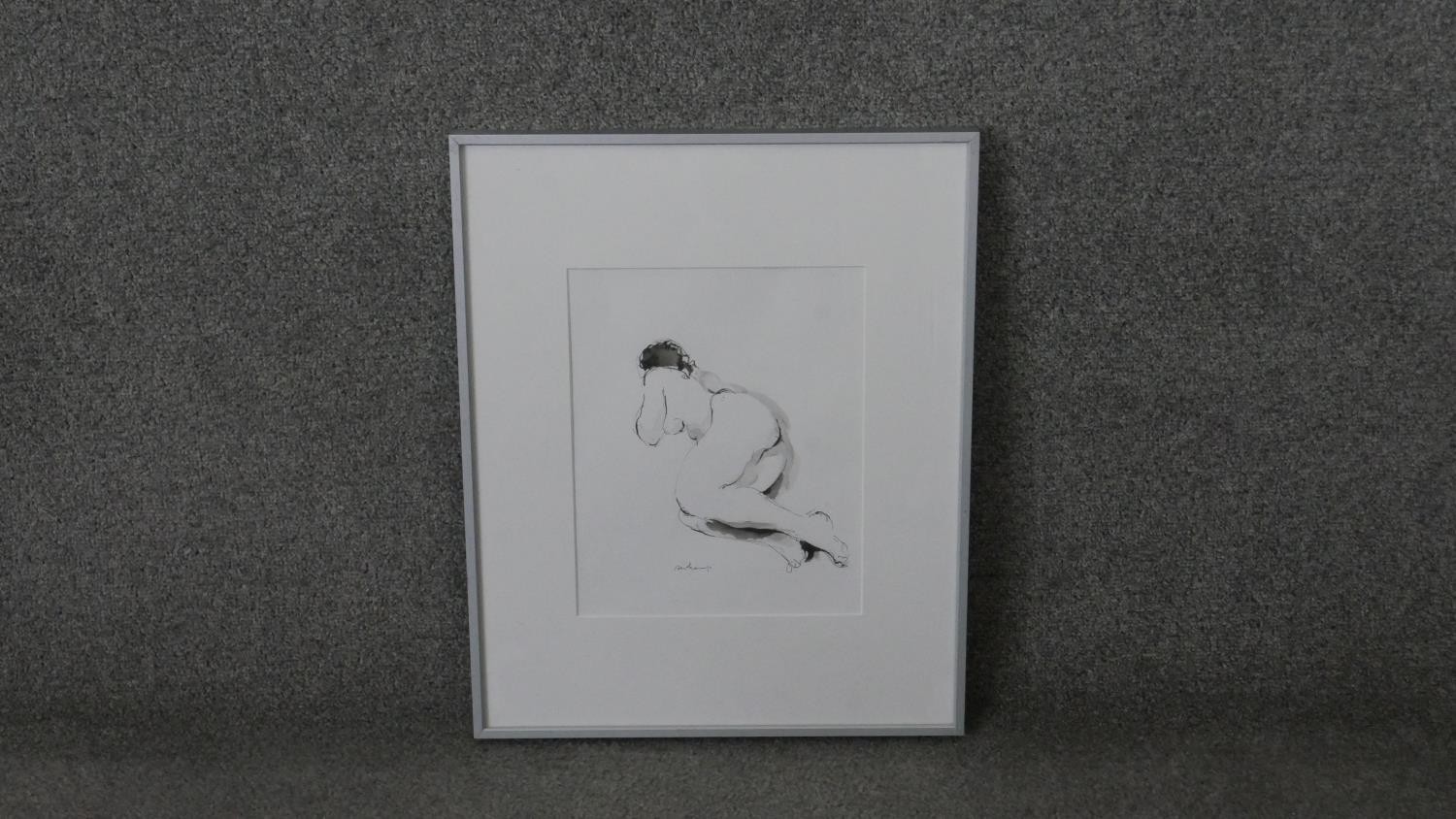 A framed and glazed signed print of a lying figure. Signed Deschamps. H.51 W.41 cm