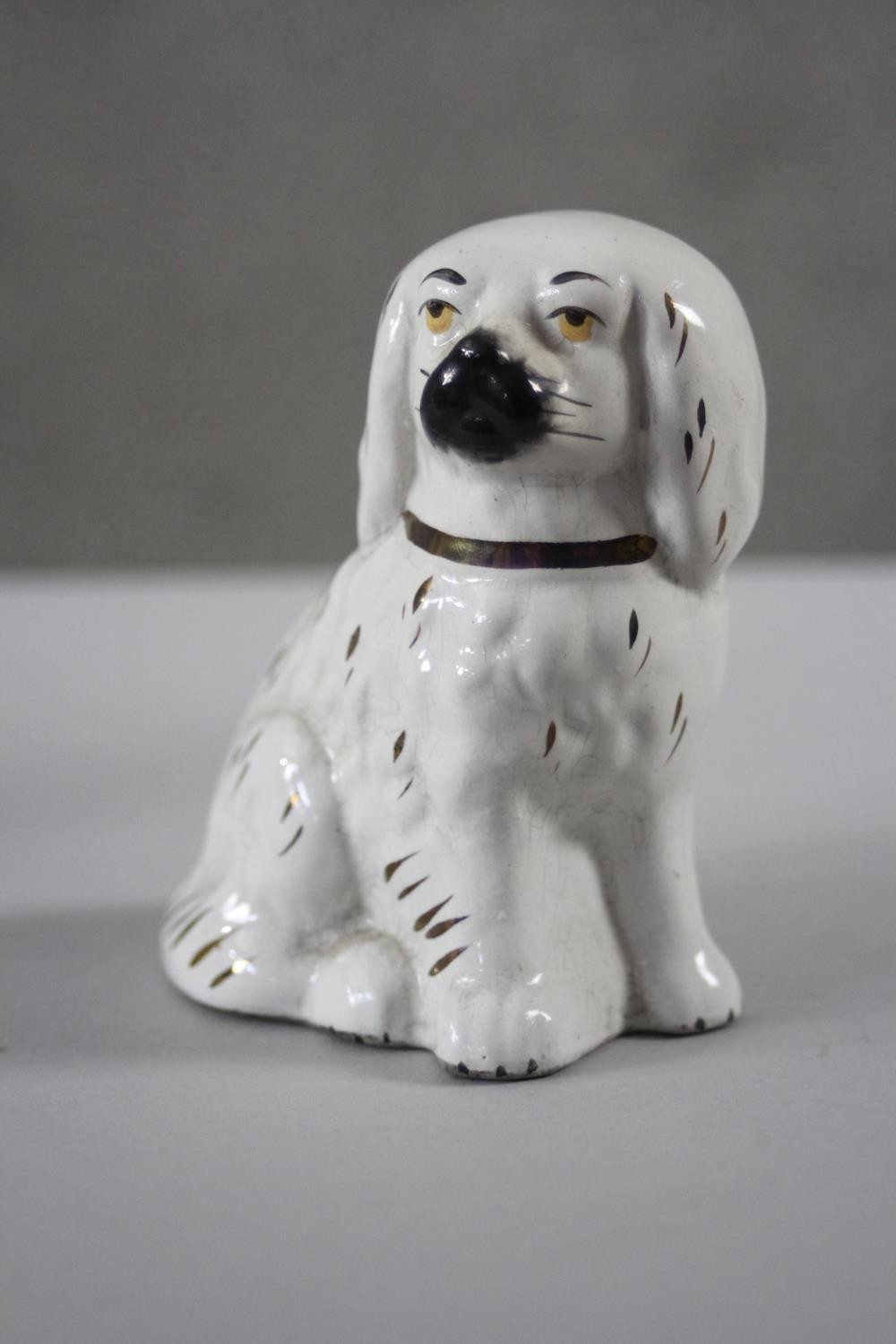 A pair of 19th century Staffordshire pottery lions with glass eyes along with a pair of - Image 8 of 8