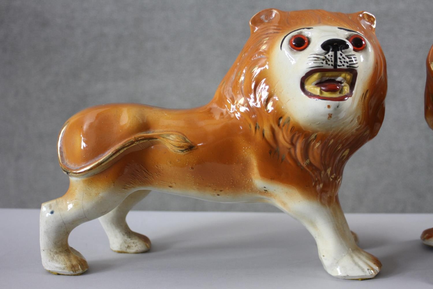 A pair of 19th century Staffordshire pottery lions with glass eyes along with a pair of - Image 6 of 8