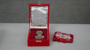 A boxed hand carved rock crystal Buddha along with a clear carved rock crystal Dorje with red velvet