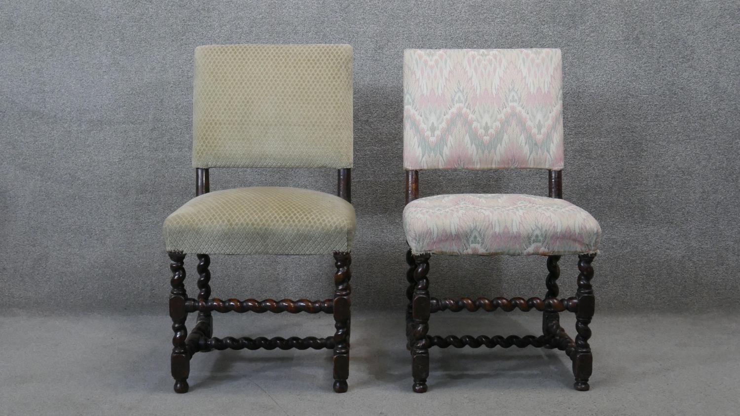 A pair of late 19th century oak dining chairs on barleytwist stretchered supports.