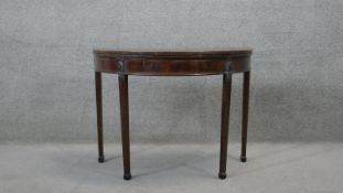 A 19th century mahogany and satinwood crossbanded card table on double gateleg square tapering