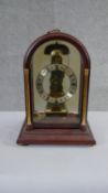 A vintage German Hermle presentation striking skeleton clock with pendulum and key. H.30 W.20 D.15cm