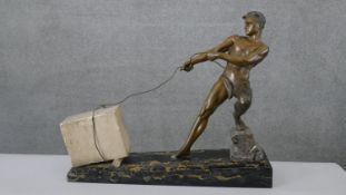 J. De Roncourt- An Art Deco cold painted spelter figure modelled and cast as a man hauling a block
