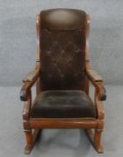 A 19th century mahogany framed rocking chair in buttoned velour upholstery.