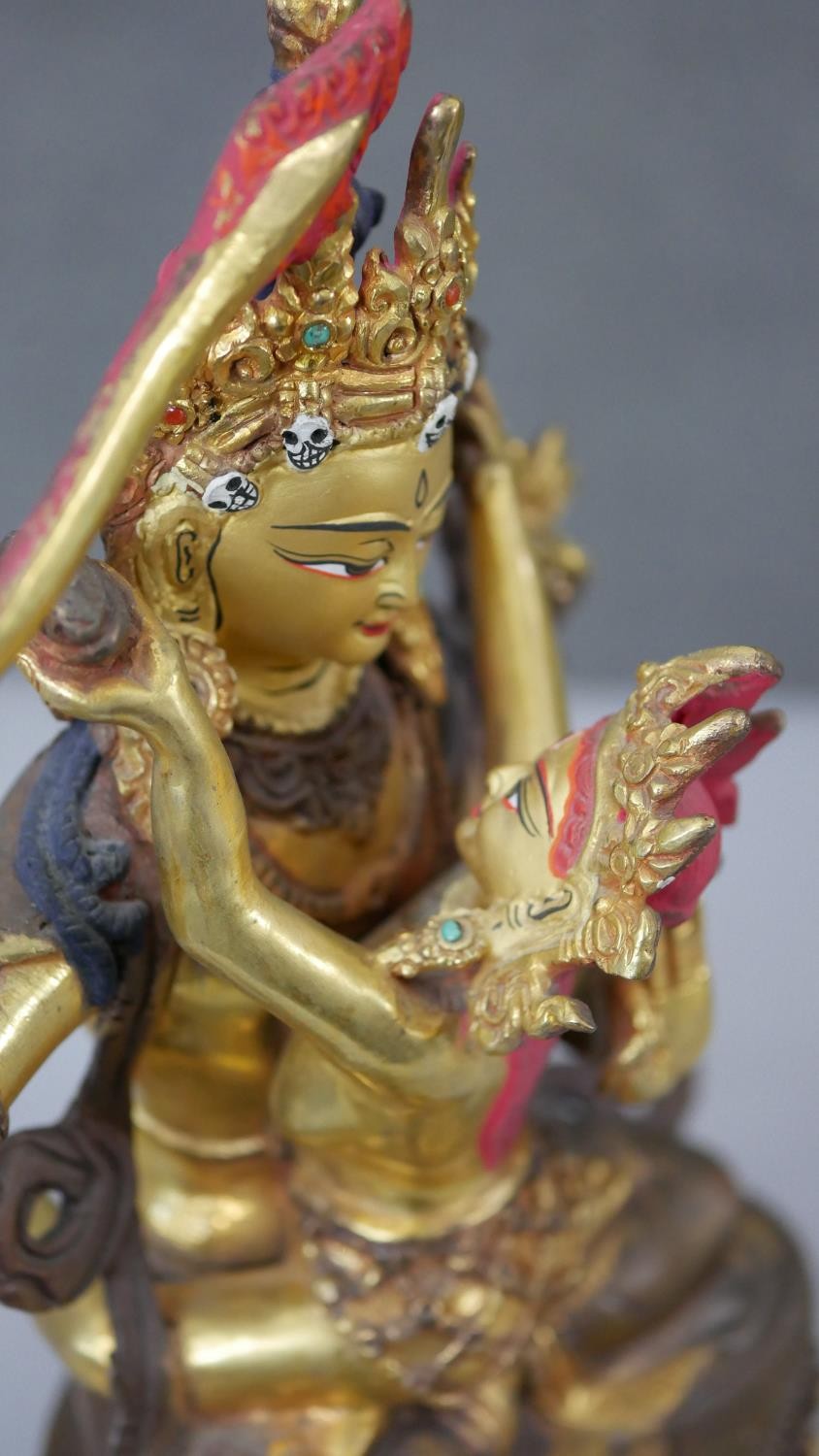 Three Tibetan gilded copper figures with hand painted detail and inlaid with coral and turquoise. - Image 4 of 9