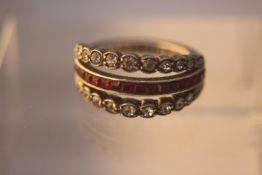 An Art Deco silver and synthetic paste ruby and sapphire convertible dress ring, one side shows ruby