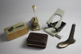 A collection of stationery and other items. Including a shoe last, a viceroy razor, a paper stamp