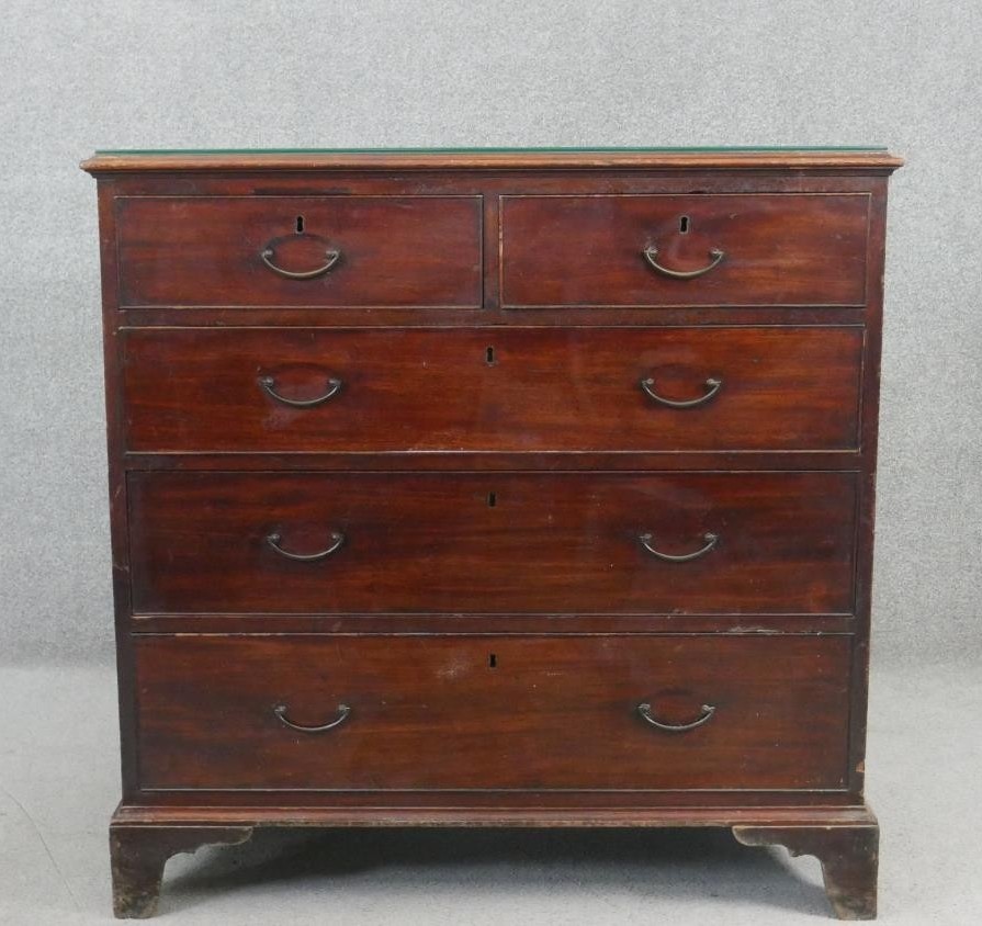 A Georgian mahogany chest of drawers on shaped bracket feet. H.99 W.110 D.52cm