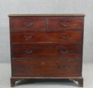 A Georgian mahogany chest of drawers on shaped bracket feet. H.99 W.110 D.52cm